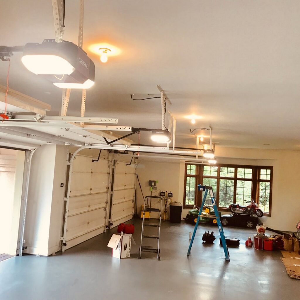 A technician giving a thumbs up after a garage door opener installation by Align Garage Door in Ringgold, GA.