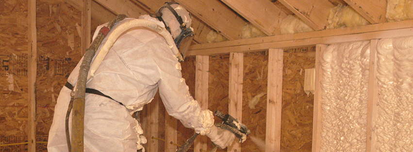 A technician applying spray foam insulation, a service by Orkin Therm Insulation for pest control and energy efficiency in Harrisburg, PA.