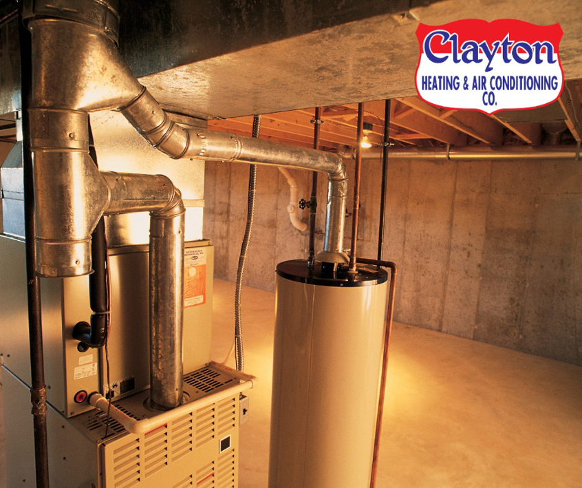 A technician changing a dirty air filter in an HVAC system for Clayton Heating & Air Conditioning Co. in Youngstown, OH.
