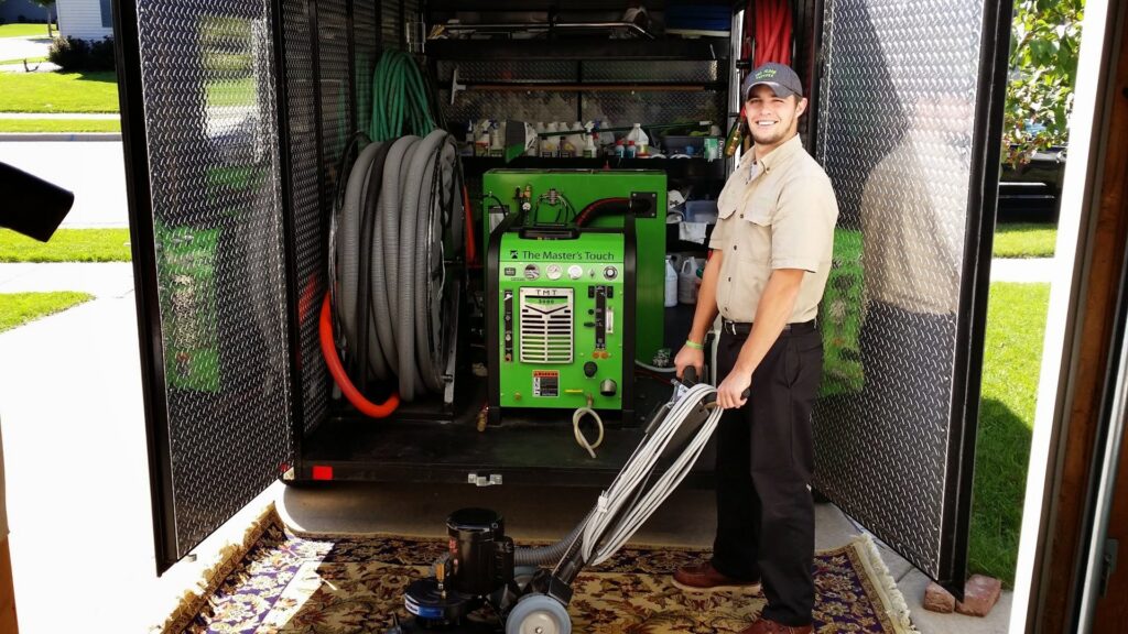 A Pro Floor Restore technician using a rotary machine to professionally clean an area rug in Appleton, WI