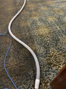A Chem-Dry of Sioux Falls technician operating a carpet cleaning machine on a residential carpet in Sioux Falls, SD.