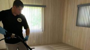 A technician from Tampa Steam Team cleaning a carpet in a residential room in Plant City, FL.