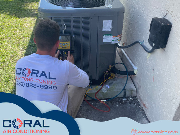 A Coral Air Conditioning technician connecting refrigerant gauges to an outdoor AC unit in Cape Coral, FL.