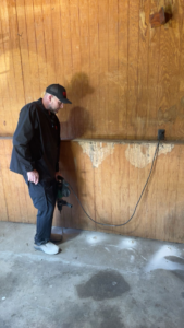 A technician drilling a floor for termite treatment by Best Termite & Pest Control, Inc. in Manchester, KY.