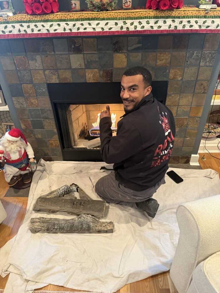 A Royal Chimney's technician performing an indoor fireplace service in Blue Ash, OH.