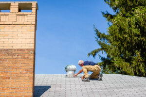 A pest control technician inspecting a roof for wildlife entry points or pest activity at Advanced Pest Control Solutions in Youngstown, OH.