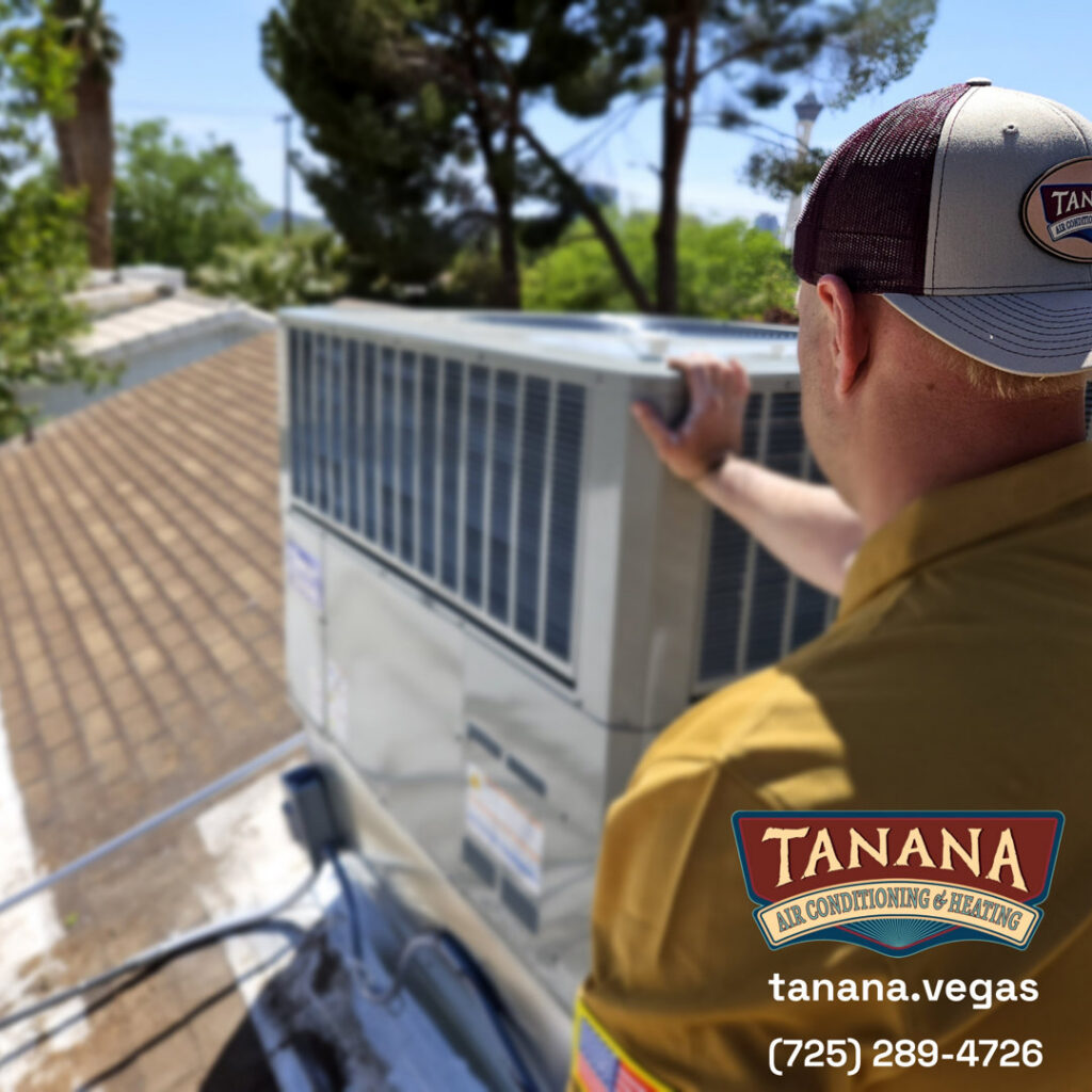 A technician from Tanana Air Conditioning & Heating inspecting a rooftop HVAC unit in Las Vegas, NV.