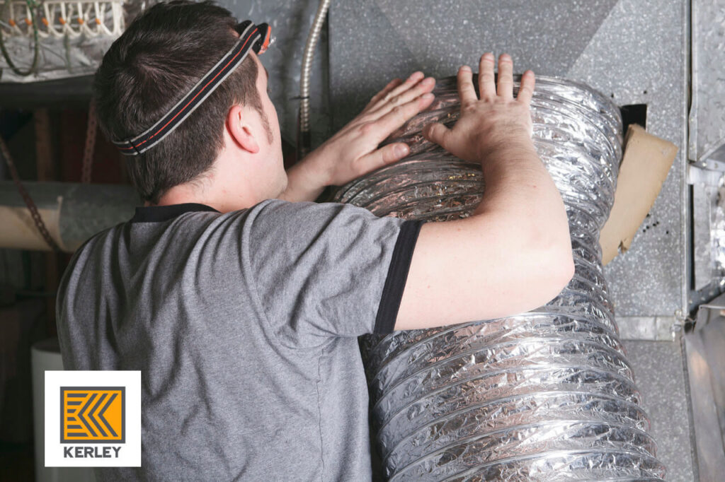 A technician installing or repairing flexible ductwork, demonstrating HVAC service by Kerley Heating & Cooling in Rock City, IL