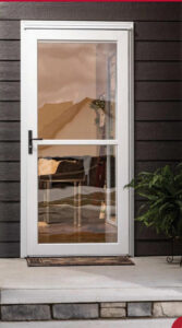 A technician on a scissor lift installing a garage door opener for Ozarks Overhead Door & More in Springfield, MO.