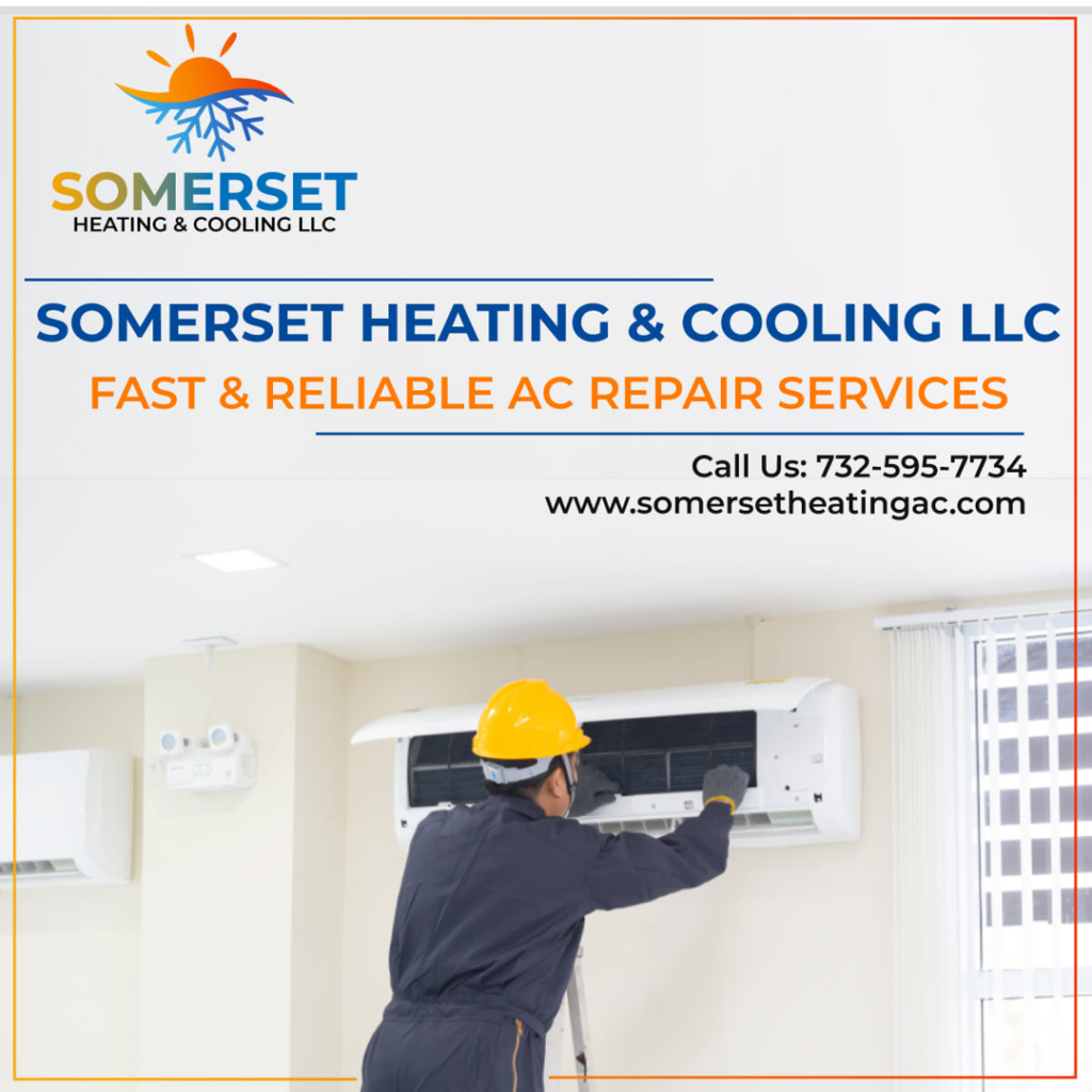 A technician on a ladder repairing an indoor air conditioning unit for Somerset Heating & Cooling LLC in Somerset, NJ.