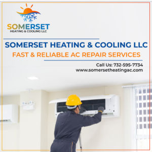 A technician on a ladder repairing an indoor air conditioning unit for Somerset Heating & Cooling LLC in Somerset, NJ.