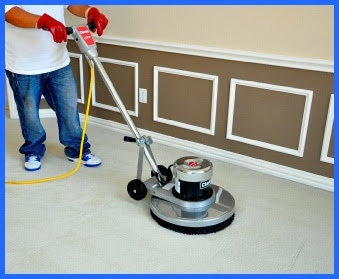 A technician operating a rotary carpet cleaning machine on a residential carpet for Steam Me Up Carpet Cleaning in Dallas, TX.