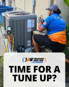 A technician performing an AC tune-up on an outdoor unit for J&W Heating and Air + Plumbing in Jacksonville, FL.