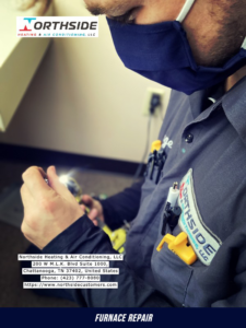 A technician performing furnace repair indoors for Air Conditioning Repair Service in Chattanooga, TN