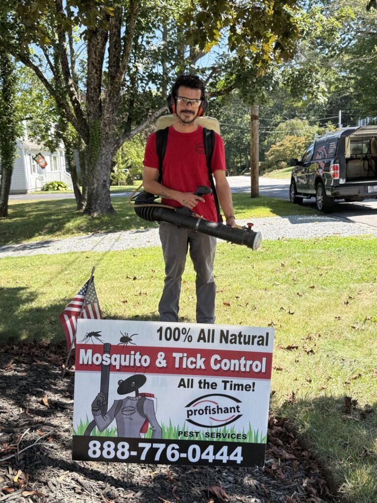 A technician performing mosquito and tick control with a sprayer for Profishant, inc. in New Bedford, MA.