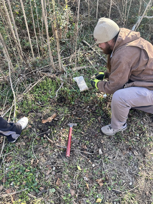 A JPC Exterminating, LLC technician placing bait or a device for wildlife control in New Orleans, LA.