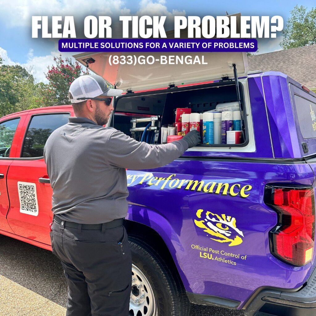 A BengalPro Exterminators technician accessing equipment from a branded truck, preparing for a pest control job in Baton Rouge, LA.