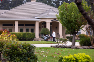A technician removing an old HVAC unit from a residential property for Tokay Heating, Air & Plumbing in North Highlands, CA.