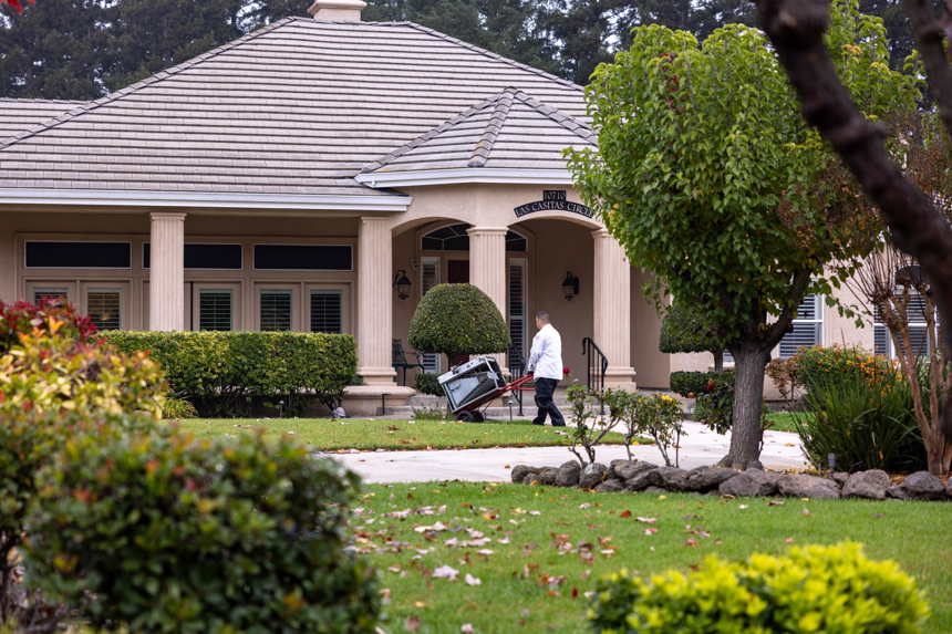 A technician removing an old HVAC unit from a residential property for Tokay Heating, Air & Plumbing in North Highlands, CA.