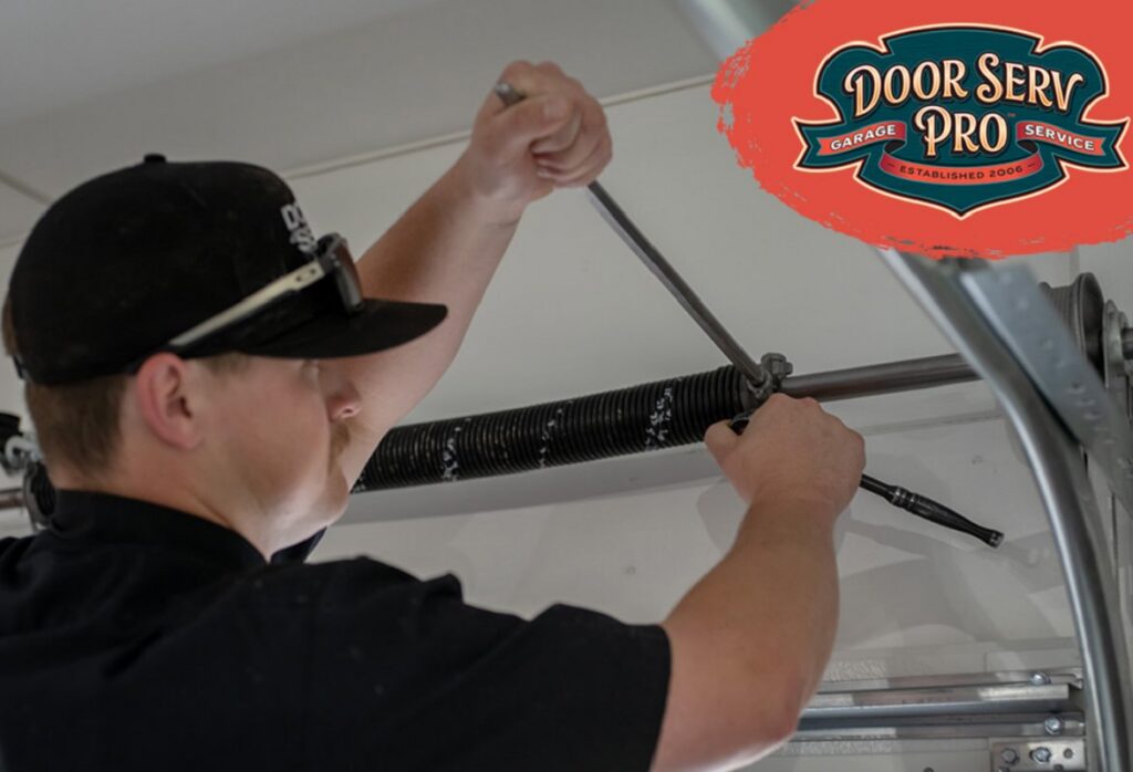 A Door Serv Pro technician repairing or adjusting a garage door spring in Inwood, WV.
