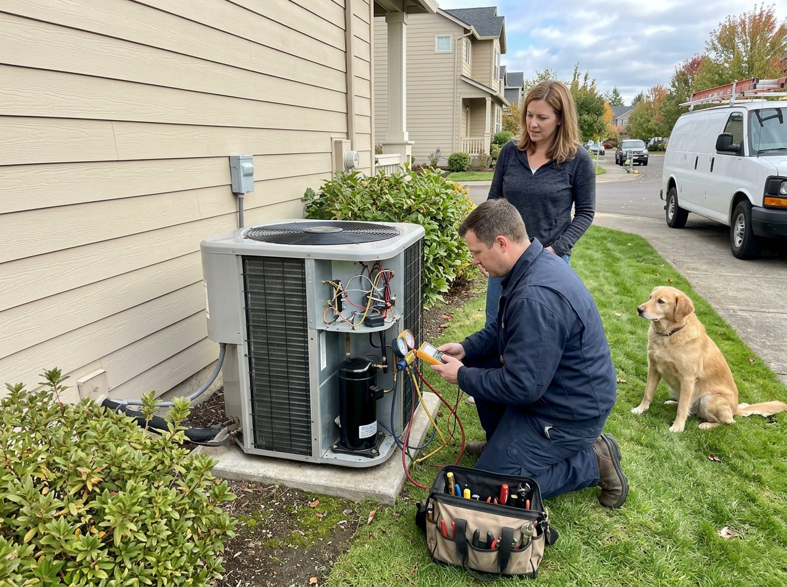 A technician repairing an outdoor AC unit for S&A Heating And Cooling in Cornelius, OR.