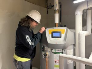 An Interstate AC technician servicing a commercial water heater in Nashville, TN.