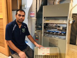 A technician servicing a furnace with lit burners, demonstrating expertise from Modern HVAC Technology in Chicago, IL.