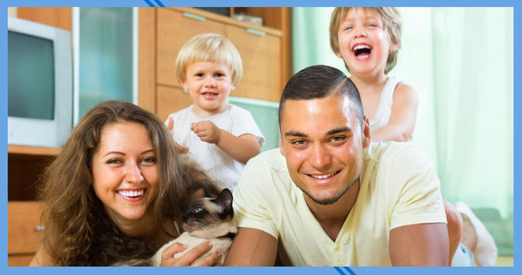 A technician in a hard hat servicing the electrical components of an outdoor HVAC unit for Stevens Refrigeration & Heating in Enid, OK