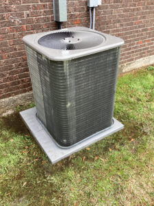 A technician servicing a water heater for Comfortech-Service Experts Jackson in Jackson, MS