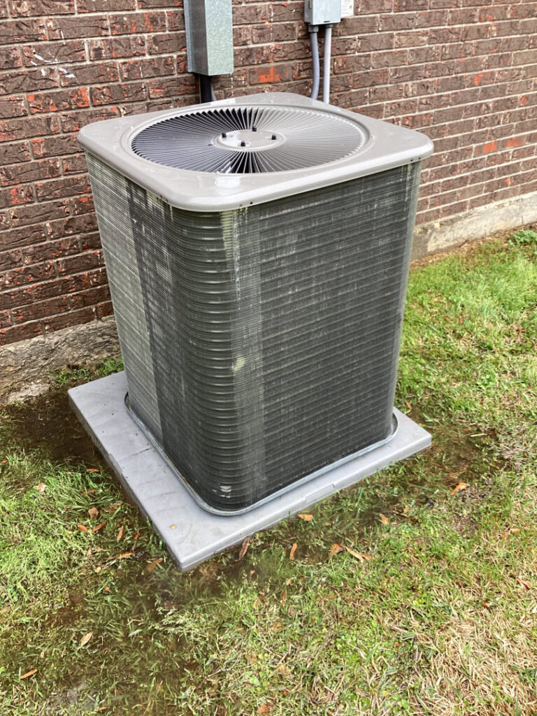 A technician servicing a water heater for Comfortech-Service Experts Jackson in Jackson, MS
