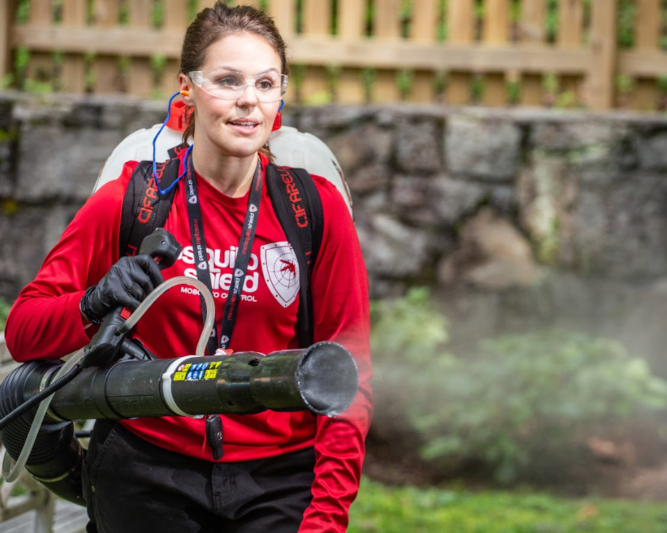 A Mosquito Shield of Savannah technician wearing safety gear while spraying for pest control in Savannah, GA.