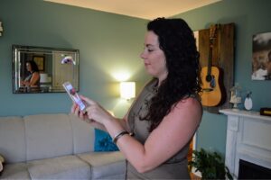 A pest control technician treating an exterior window frame during a service for Clark's Classic Pest Control in Nashville, TN.