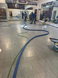 A technician using a handheld tool for upholstery cleaning by Rise N Shine Cleaning in San Antonio, TX