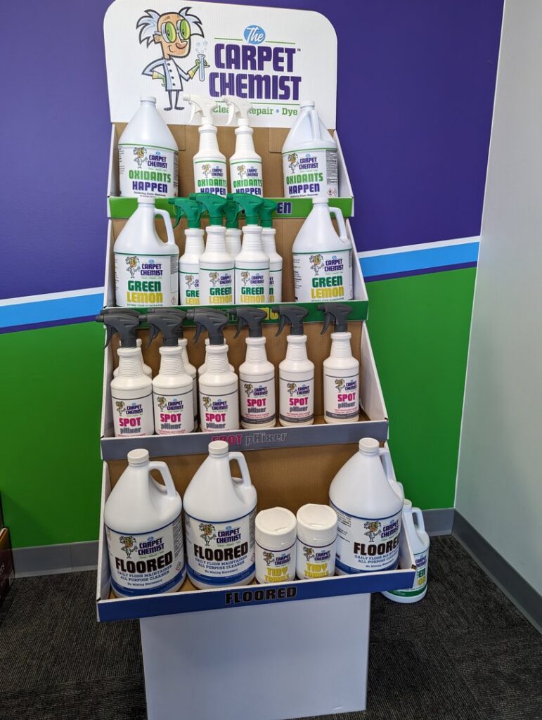 A technician using a power carpet stretcher for installation or repair by The Carpet Chemist in Louisville, KY.