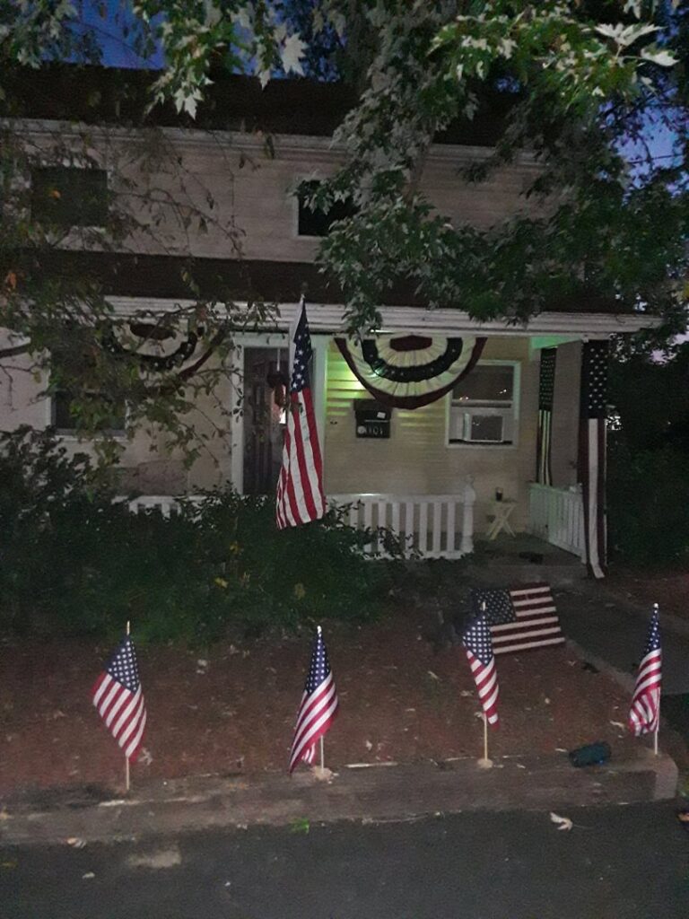 A technician standing next to a Bob Thomas Pest Control truck in Latrobe, PA, ready to provide service.