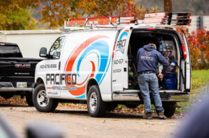 A technician working from a Pacifico Heating and Cooling branded service van in Shadyside, OH.