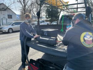 Chimney Wizards LLC technicians handling chimney sweep equipment from their truck, preparing for a job in Orofino, ID.