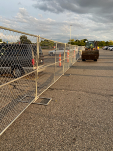 Temporary chain-link fencing installed for a construction site or event by HP Fence in Warren, MI.