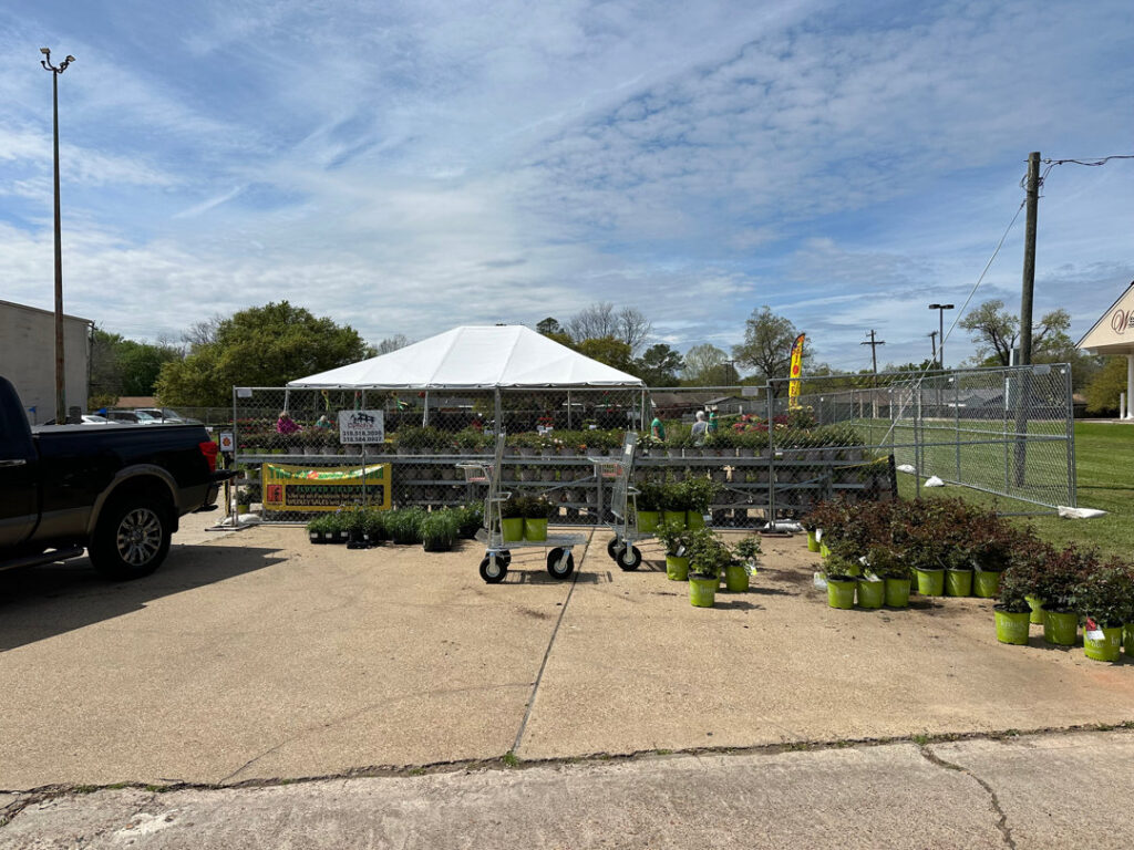 Temporary chain-link fencing enclosing an outdoor plant nursery, provided by Lynch's Temporary Fencing & Dumpster rental in Bossier City, LA.