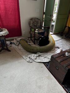 Temporary HVAC flexible ducting running into a home for service by JN Heating & Cooling in Eure, NC