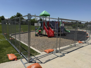 Temporary chain-link fence installed around a playground by Fence 4 Colorado in Thornton, CO.