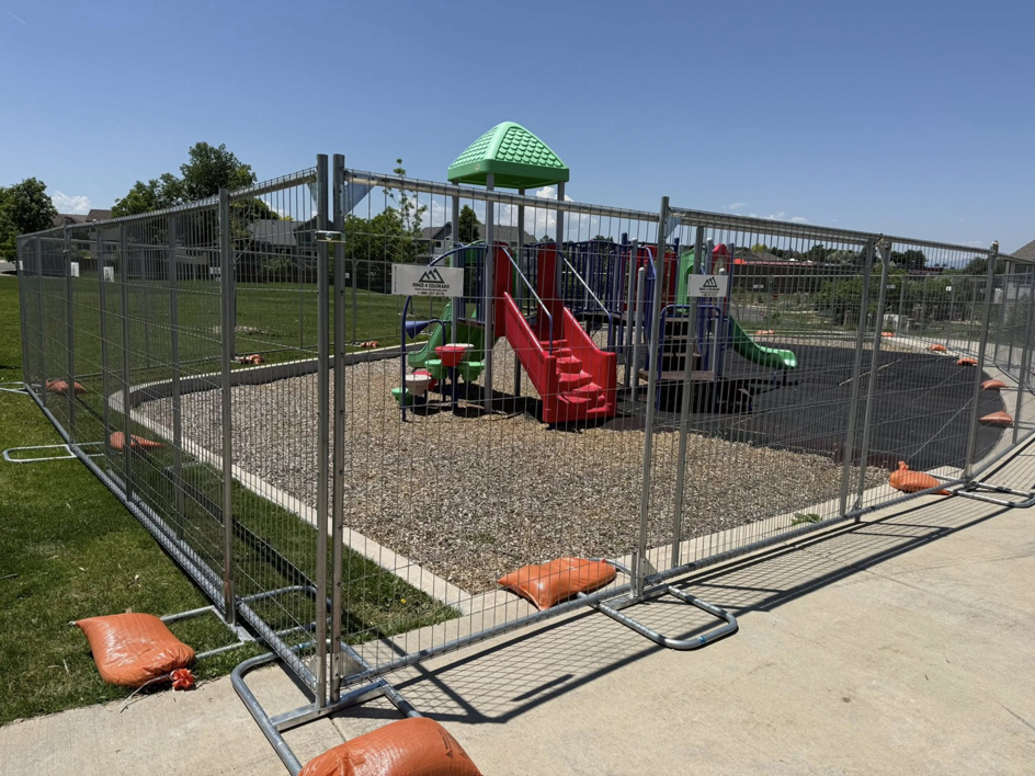 Temporary chain-link fence installed around a playground by Fence 4 Colorado in Thornton, CO.