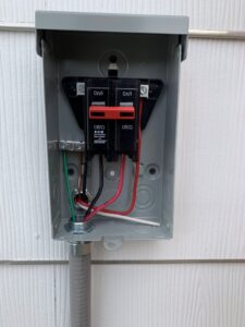 A large temporary power distribution panel with multiple outlets, set up by AMG Electric LLC Laramie, WY.