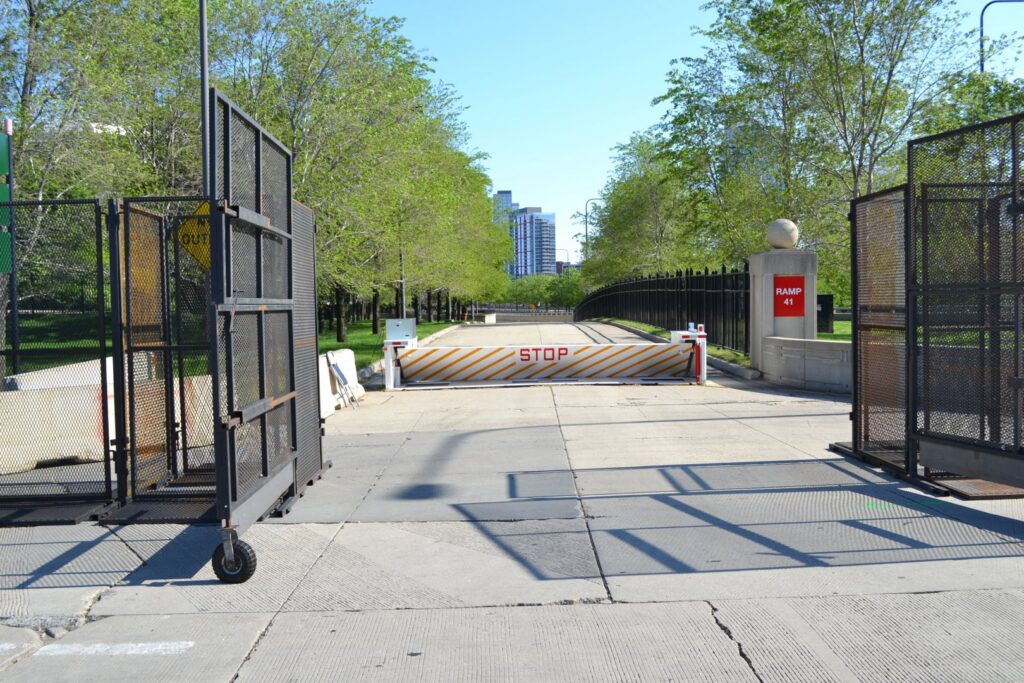 Temporary road barrier and fencing setup on a city street by Checkmate Global in Frederick, MD.