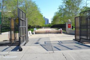 Temporary road barrier and fencing setup on a city street by Checkmate Global in Frederick, MD.