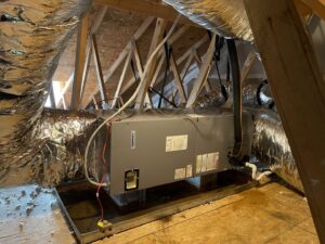 A newly installed Tempstar air handler and insulated ductwork in an attic by KMC Heating and Cooling LLC in Clarksville, TN.