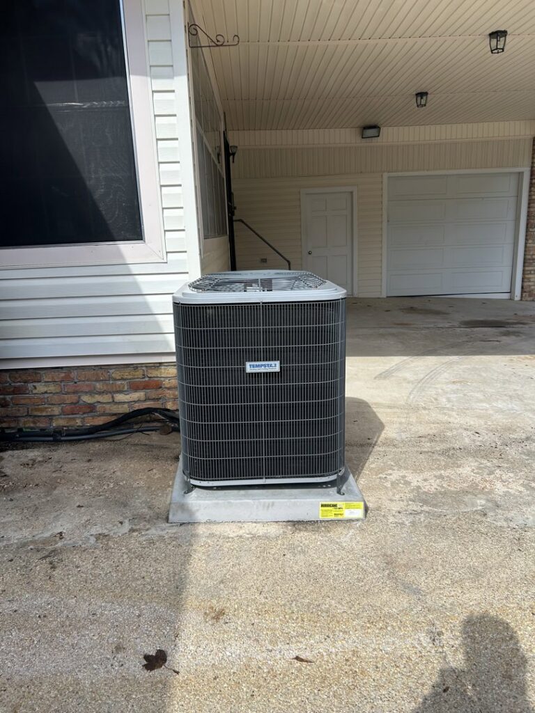 A Tempstar outdoor AC unit installed by Breezy Heating and Cooling in Mobile, AL.