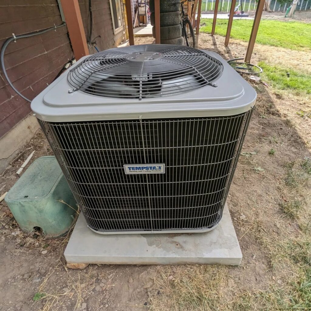 A Tempstar outdoor air conditioning unit on a concrete pad, installed by Inspector Rogers LLC in Draper, UT.
