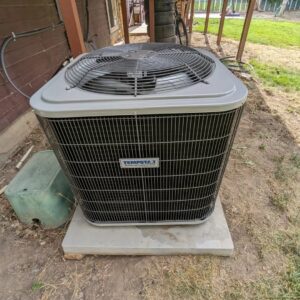 A Tempstar outdoor air conditioning unit on a concrete pad, installed by Inspector Rogers LLC in Draper, UT.
