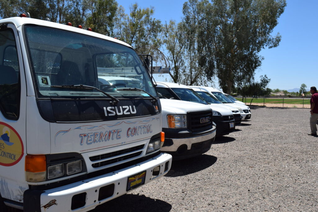 A specialized termite control truck and other service vehicles in the fleet of Sun Lakes Pest Control in Chandler, AZ.
